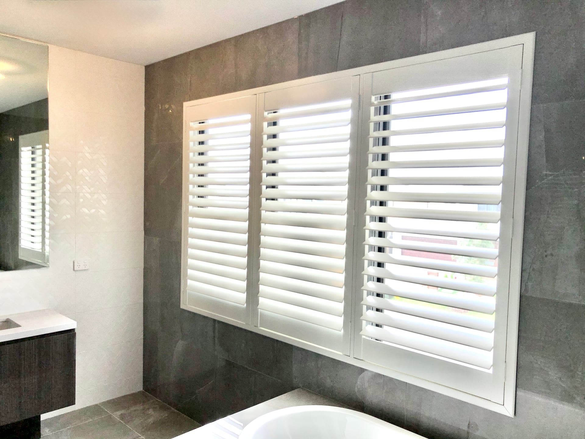 White plantation shutters installed on windows in a Sydney home